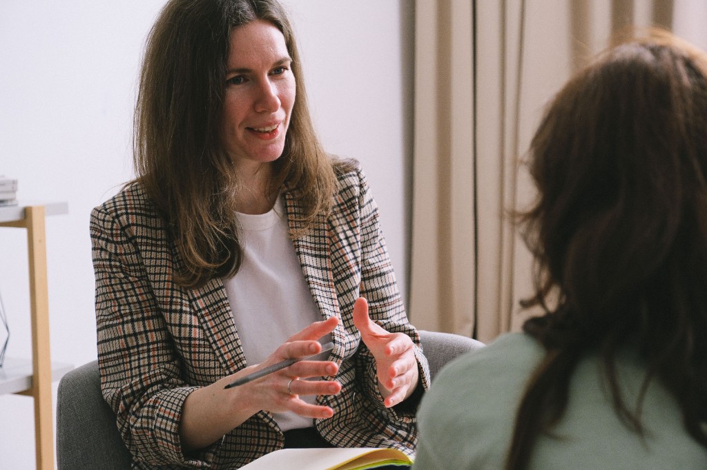 Therapist speaking with a client