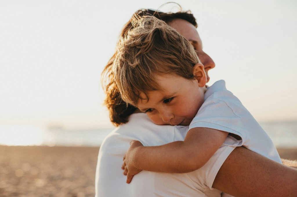 Parent holding child