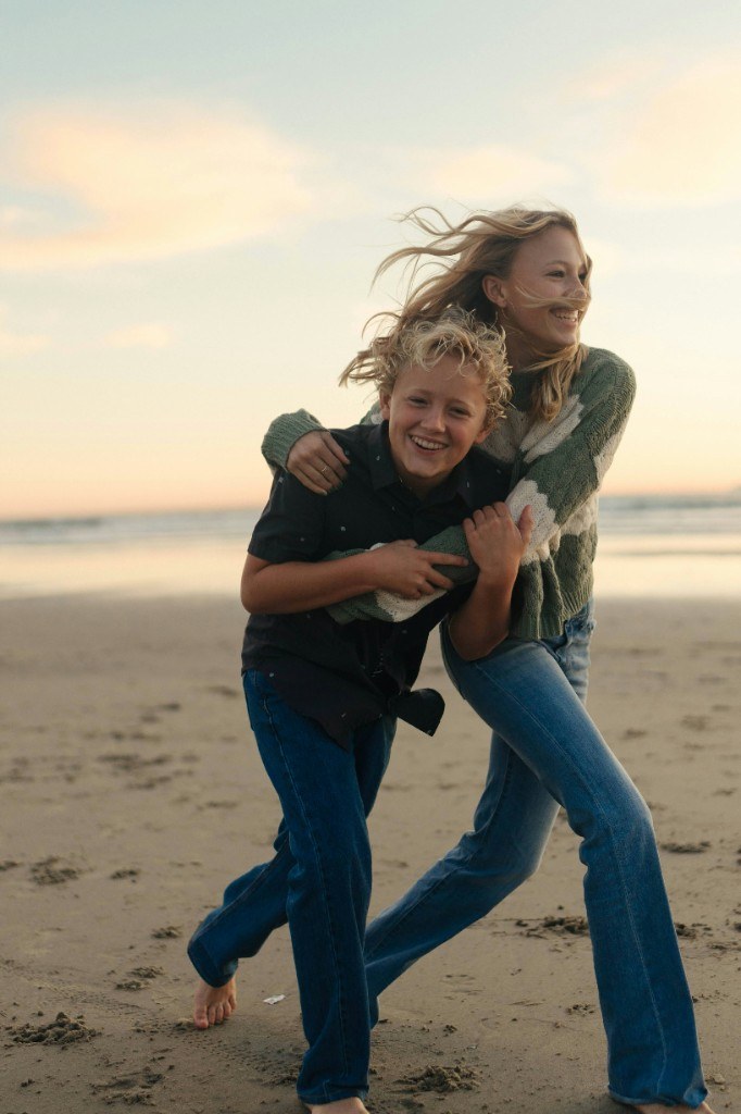 Two children playing on the beach