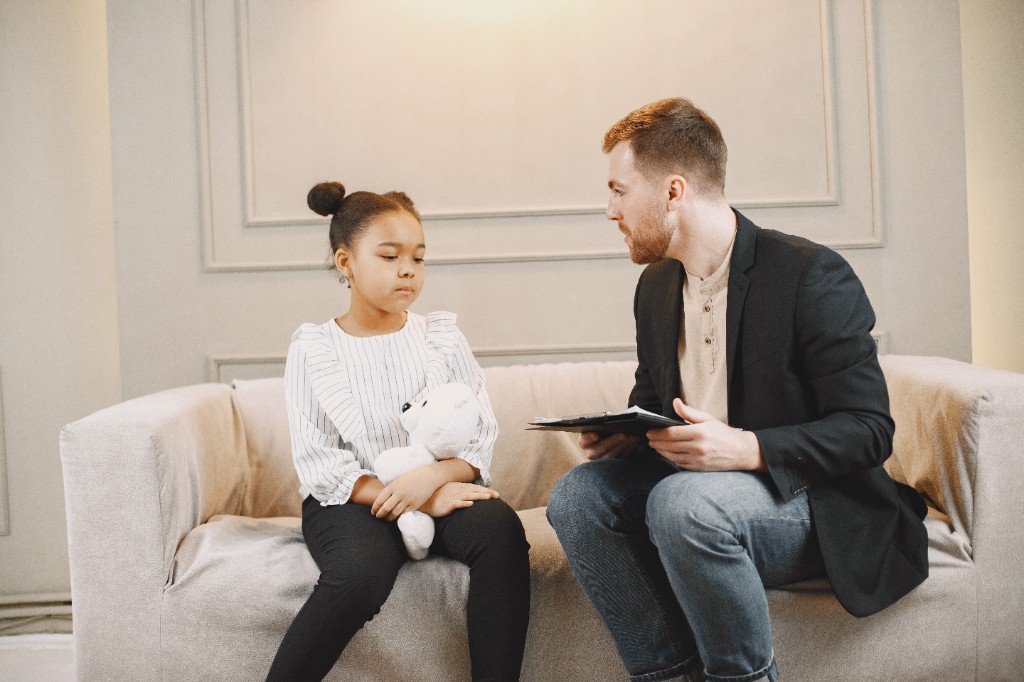 Therapist talking with a child